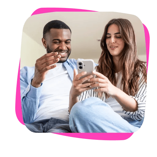 couple sitting with woman on mobile